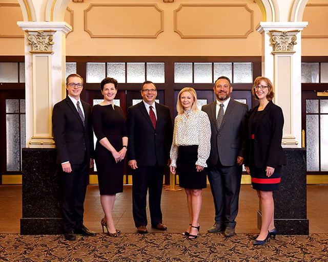 Photo of the firm's six attorneys